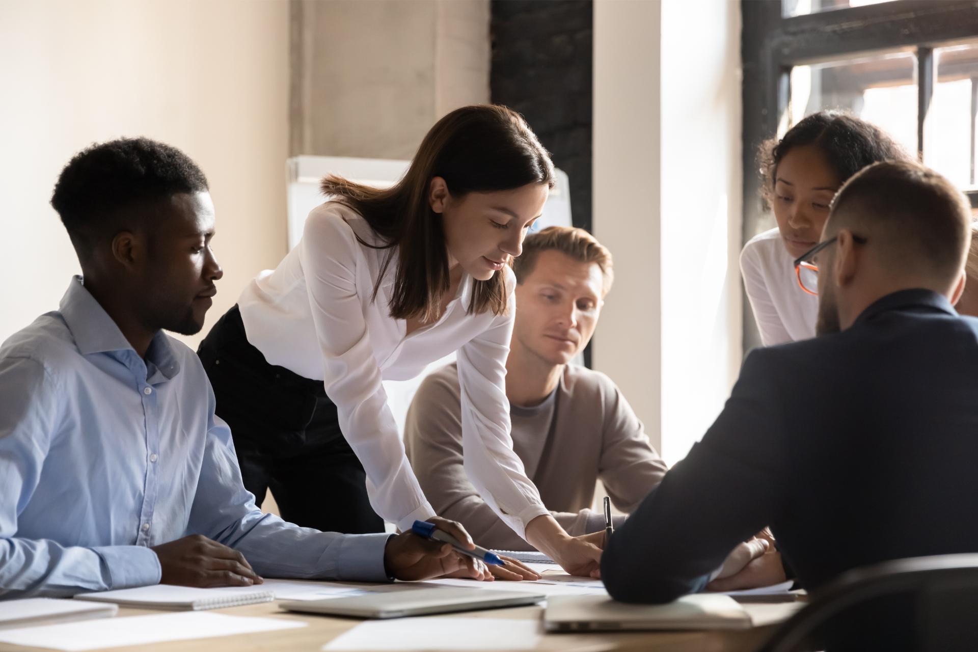 Diverse colleagues working on project together