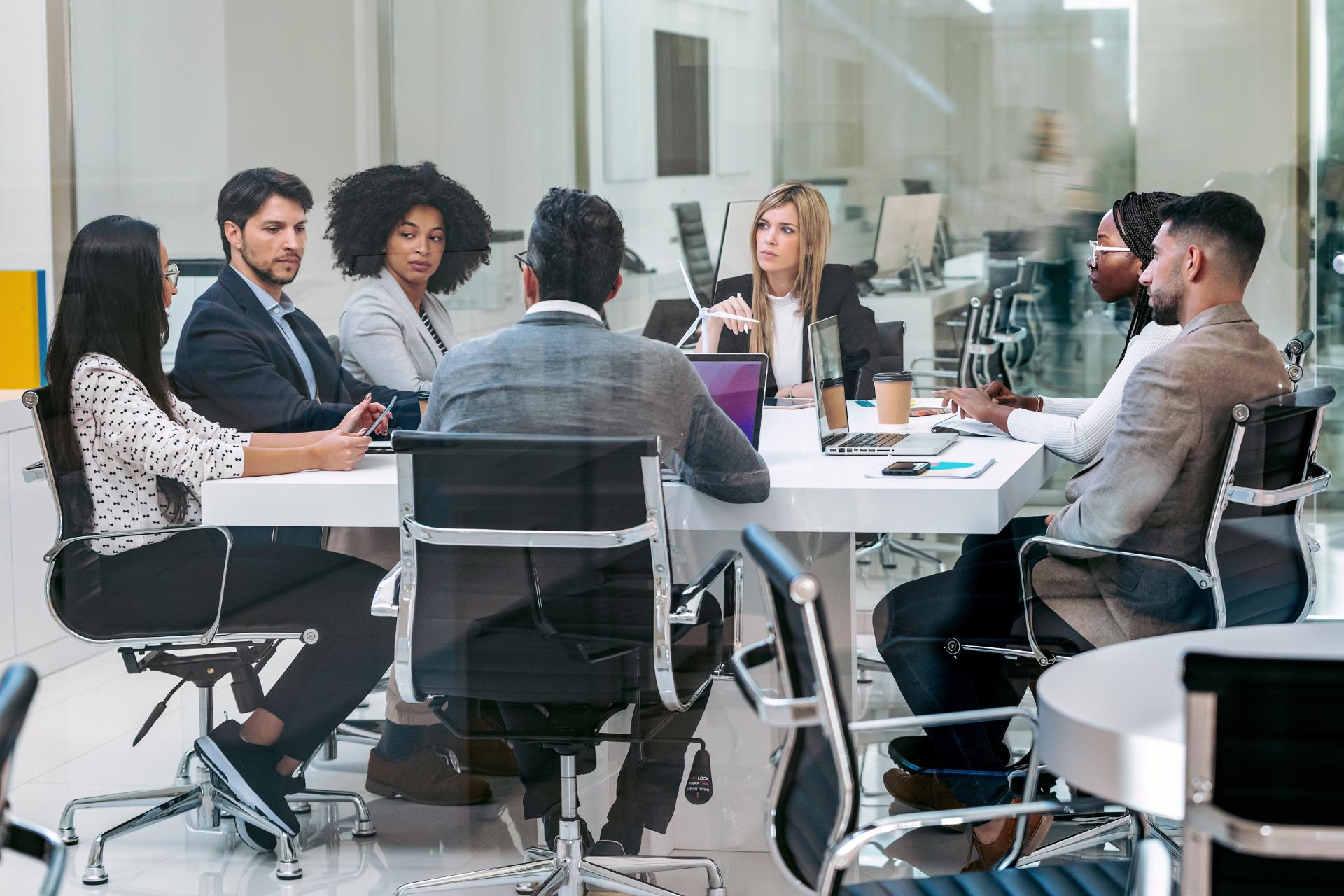 Business people discussing together in conference room during meeting at office in a modern startup