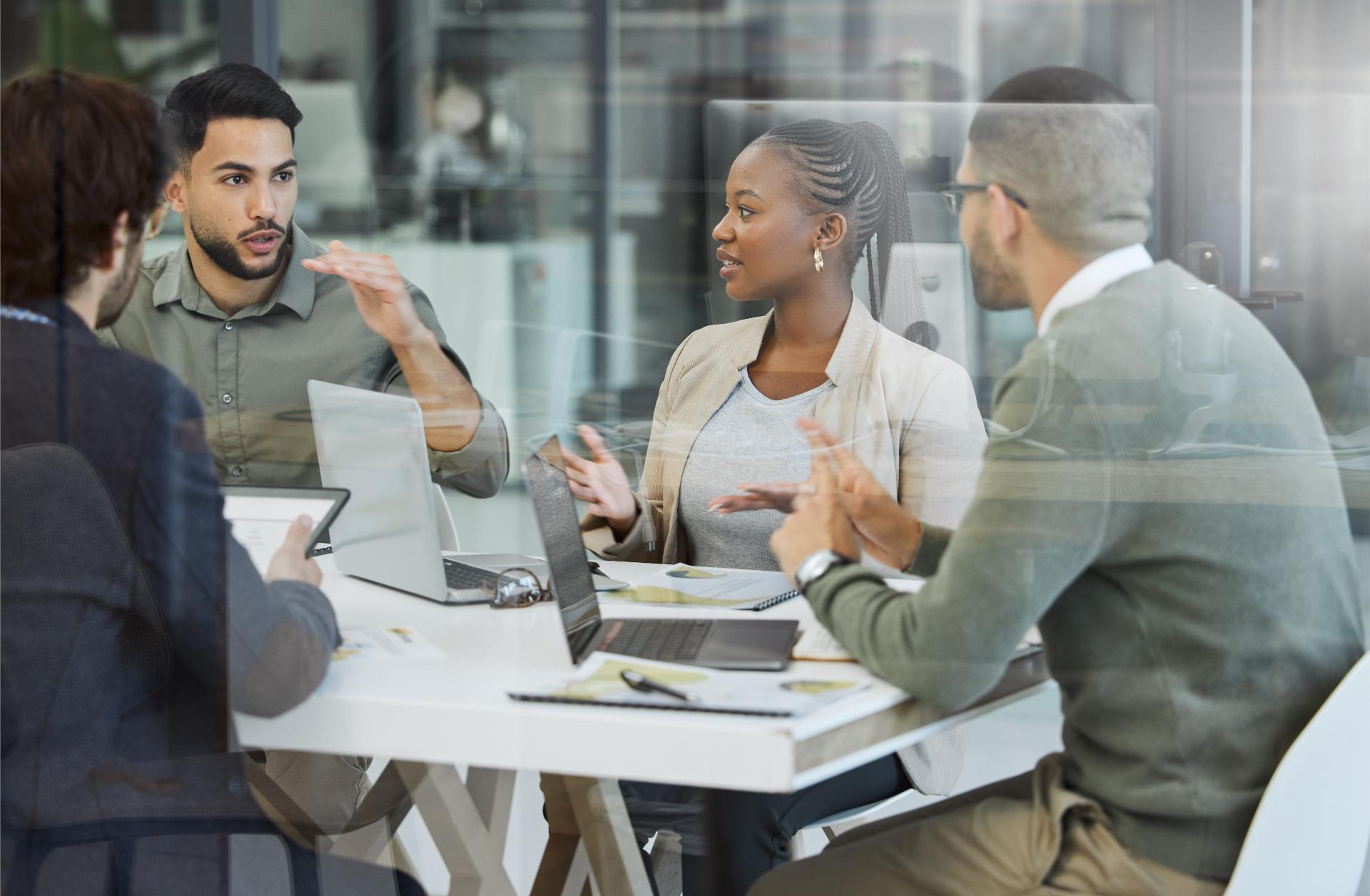 Meeting collaboration and business people in discussion in the office while working together