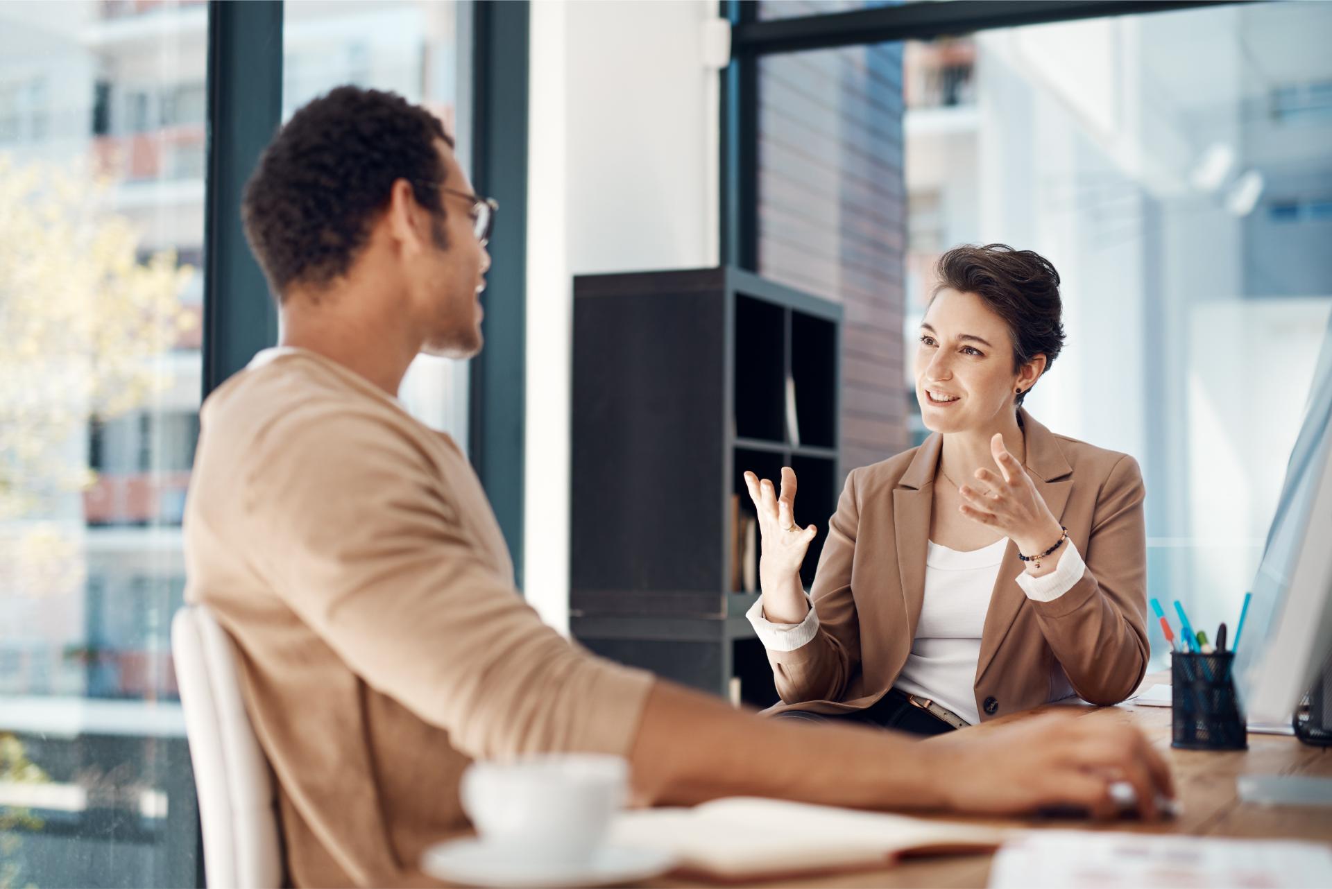 Mentor training and a woman manager with an employee in the office for coaching on company vision