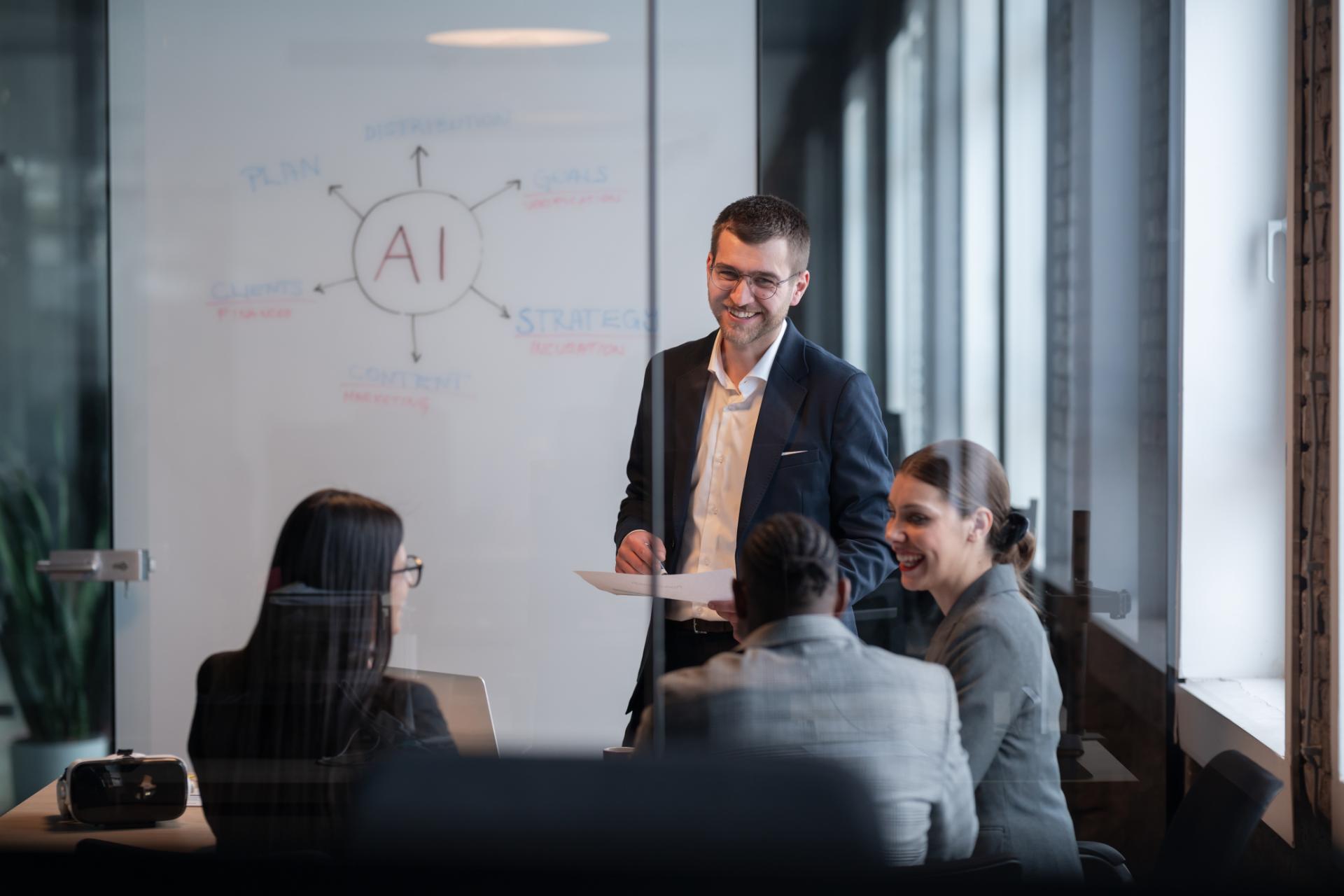 Diverse business team in a modern office during a meeting discussing artificial intelligence strategy