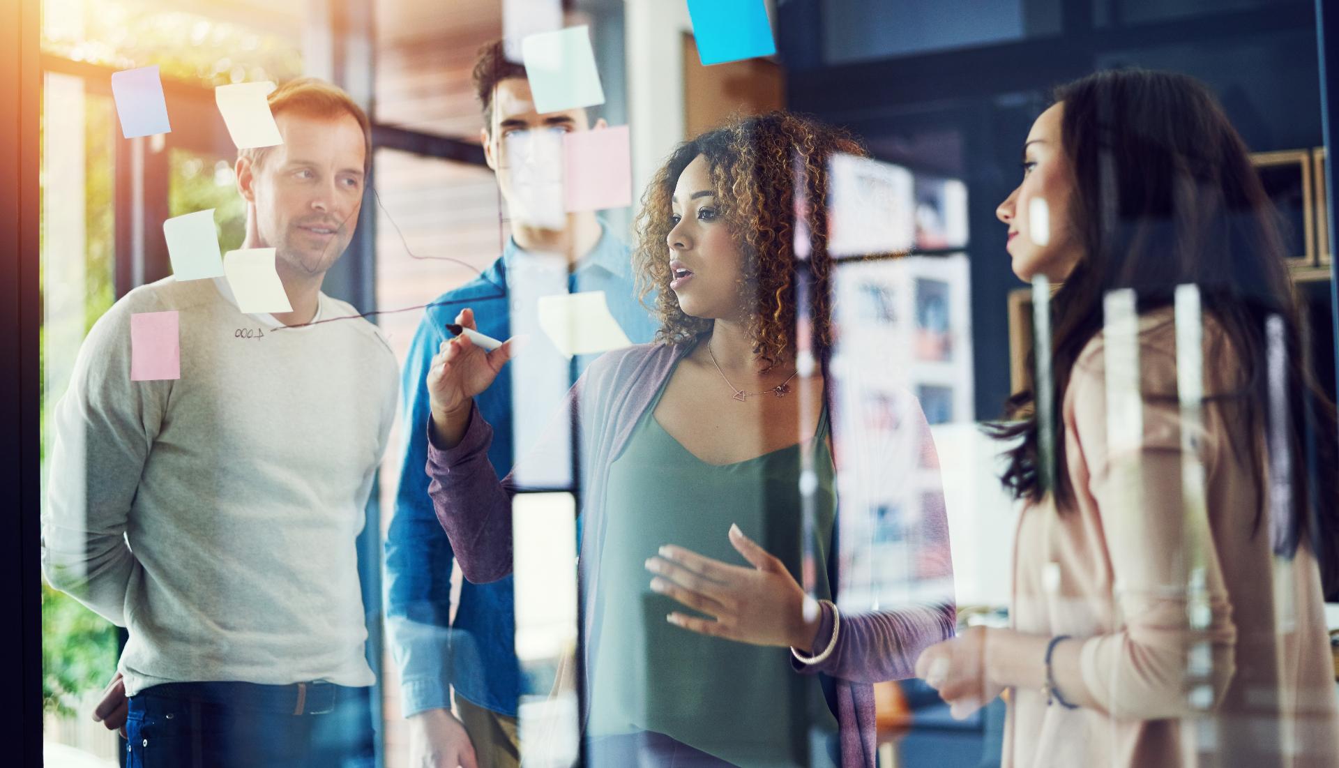 People glass or planning in office for creativity brainstorming or project management. Design team woman leader or reflection in creative agency for discussion