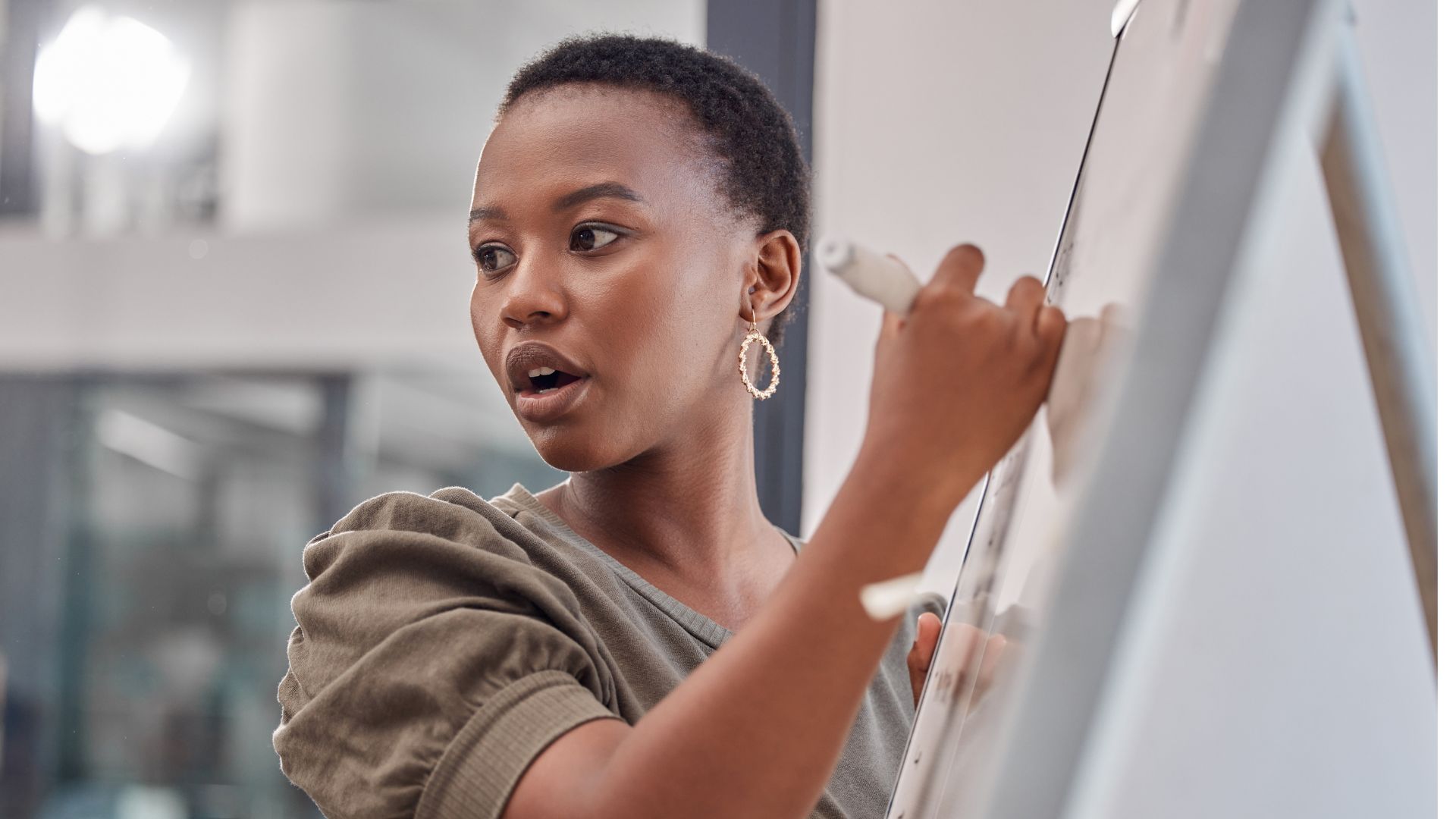 facilitator presenting strategy framework on whiteboard