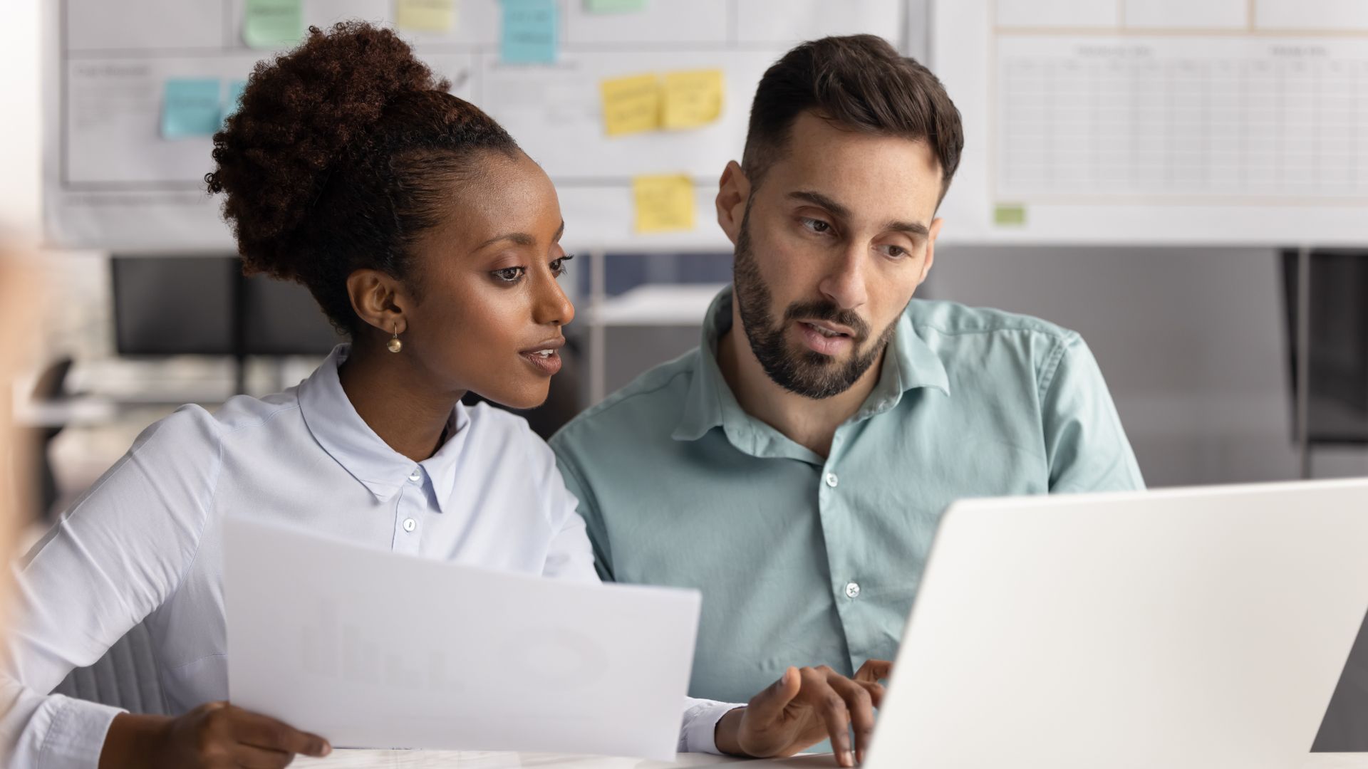 focused workspace coffee notebook city view