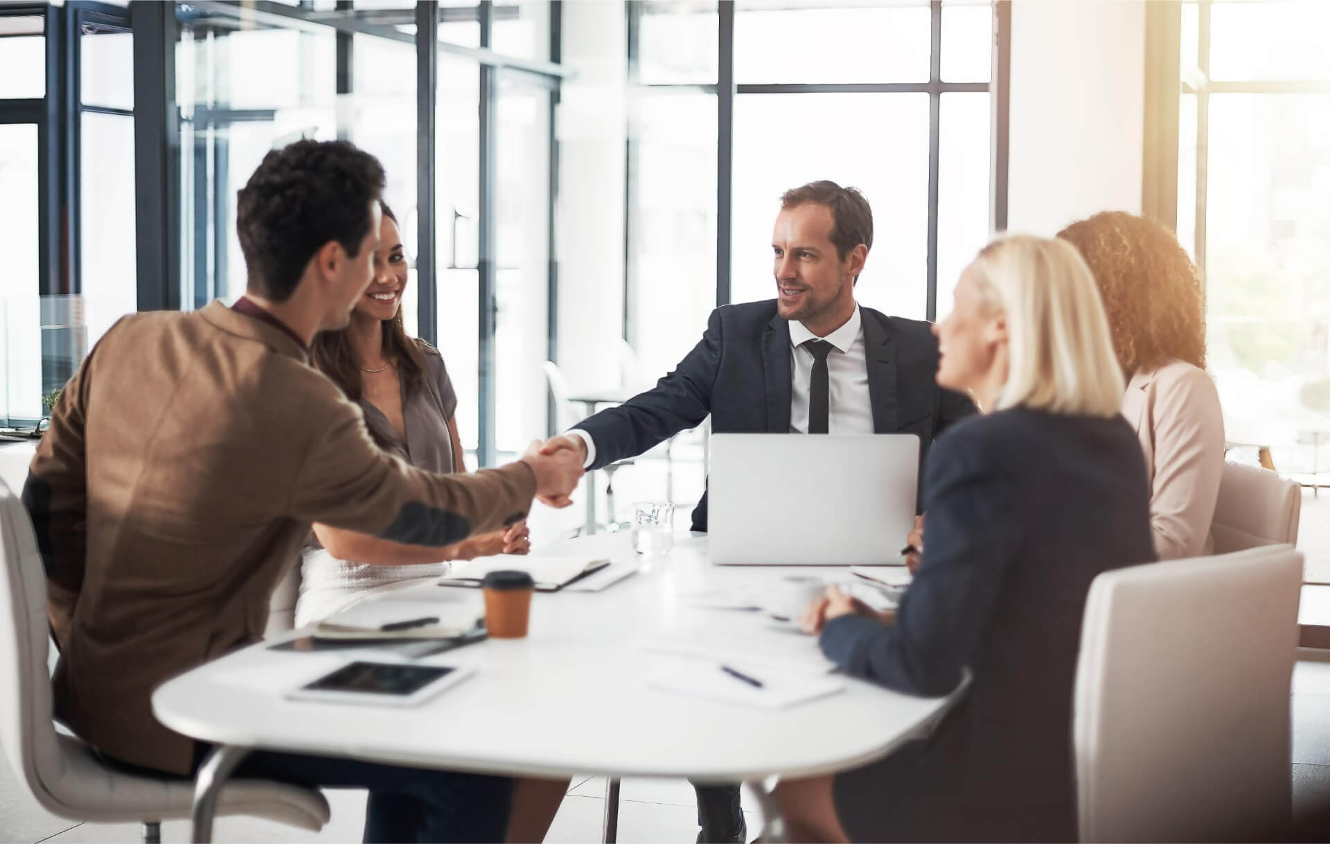 Business people handshake and meeting for b2b deal partnership or teamwork in office conference